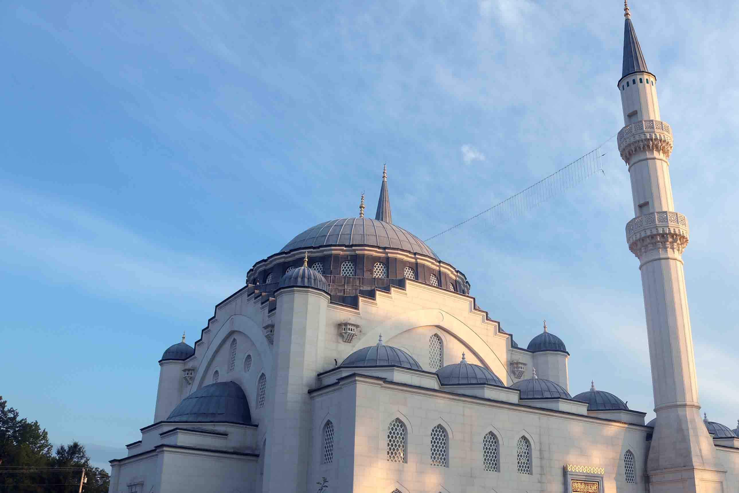 A grand mosque with a large blue dome