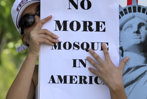 A local citizen protests across the street from a business warehouse where the Islamic Center of Temecula Valley currently hold their services in Temlecula, California July 30, 2010. The Islamic Center is planning to build a 25,000 sq ft (2, 322 sq m) mosque next to the local Baptist church in the community.
 REUTERS/Mike Blake  (UNITED STATES - Tags: RELIGION CIVIL UNREST) - GM1E67V0E0S01