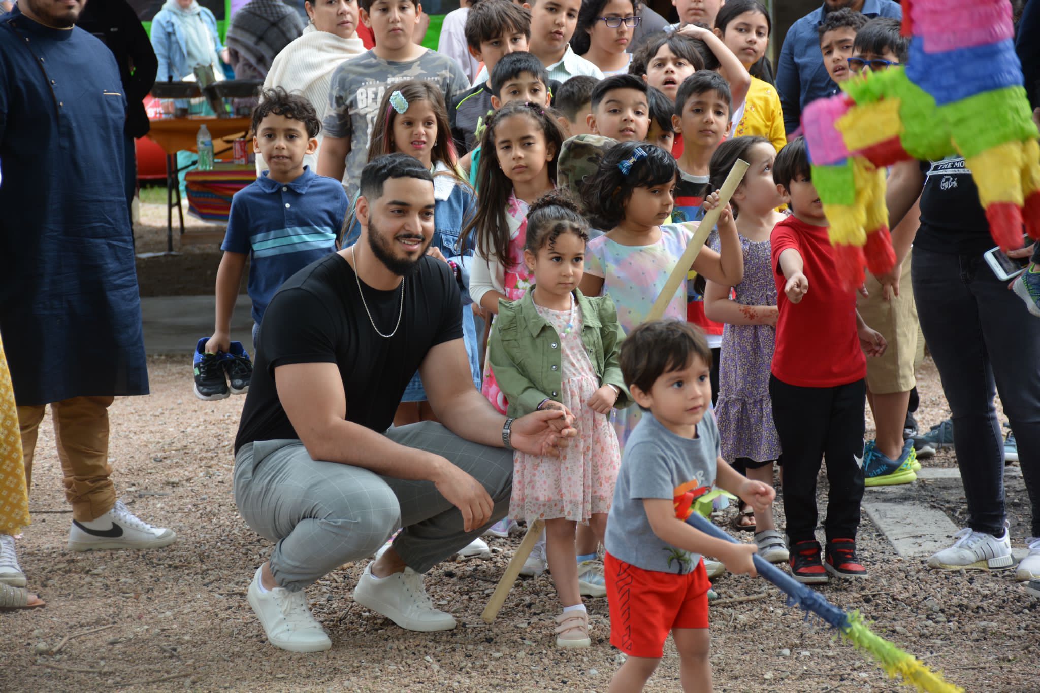Young Latino family enjoying the IslamInSpanish Eid Al-Fitr festivities in Dallas, TX.
